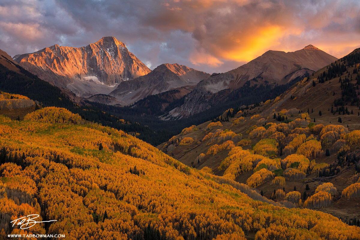 This Colorado photo depicts colorful light at sunset over Capitol Peak with vibrant fall foliage in the foreground.