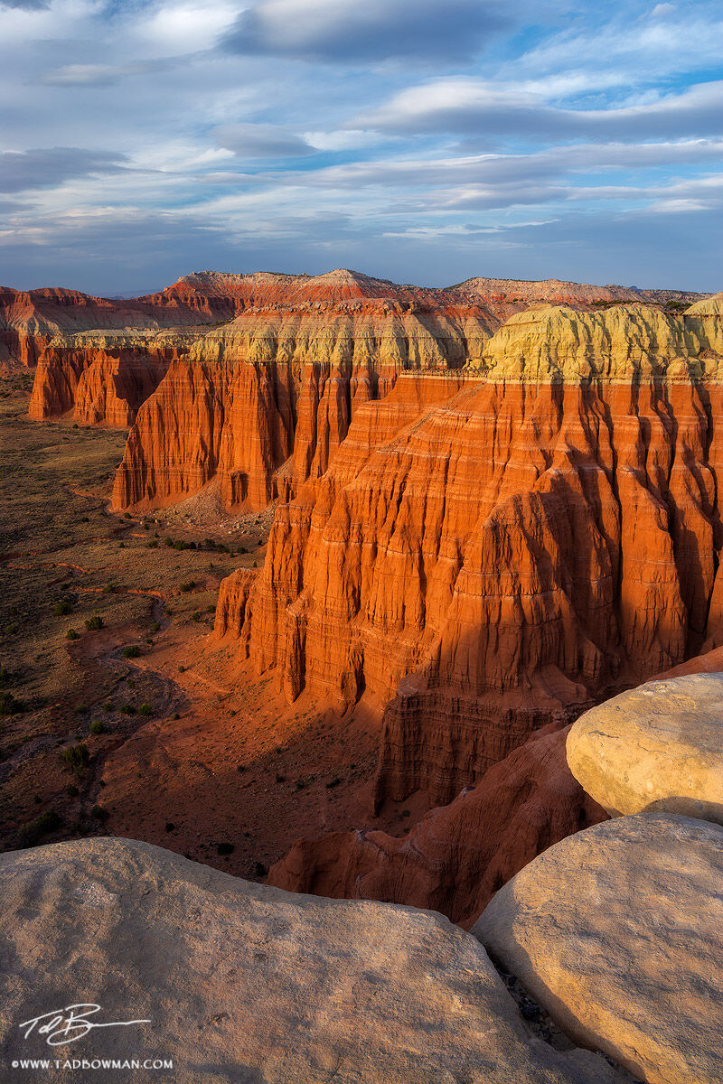 This Utah photo depicts warm light on rock formations located in Cathedral Valley
