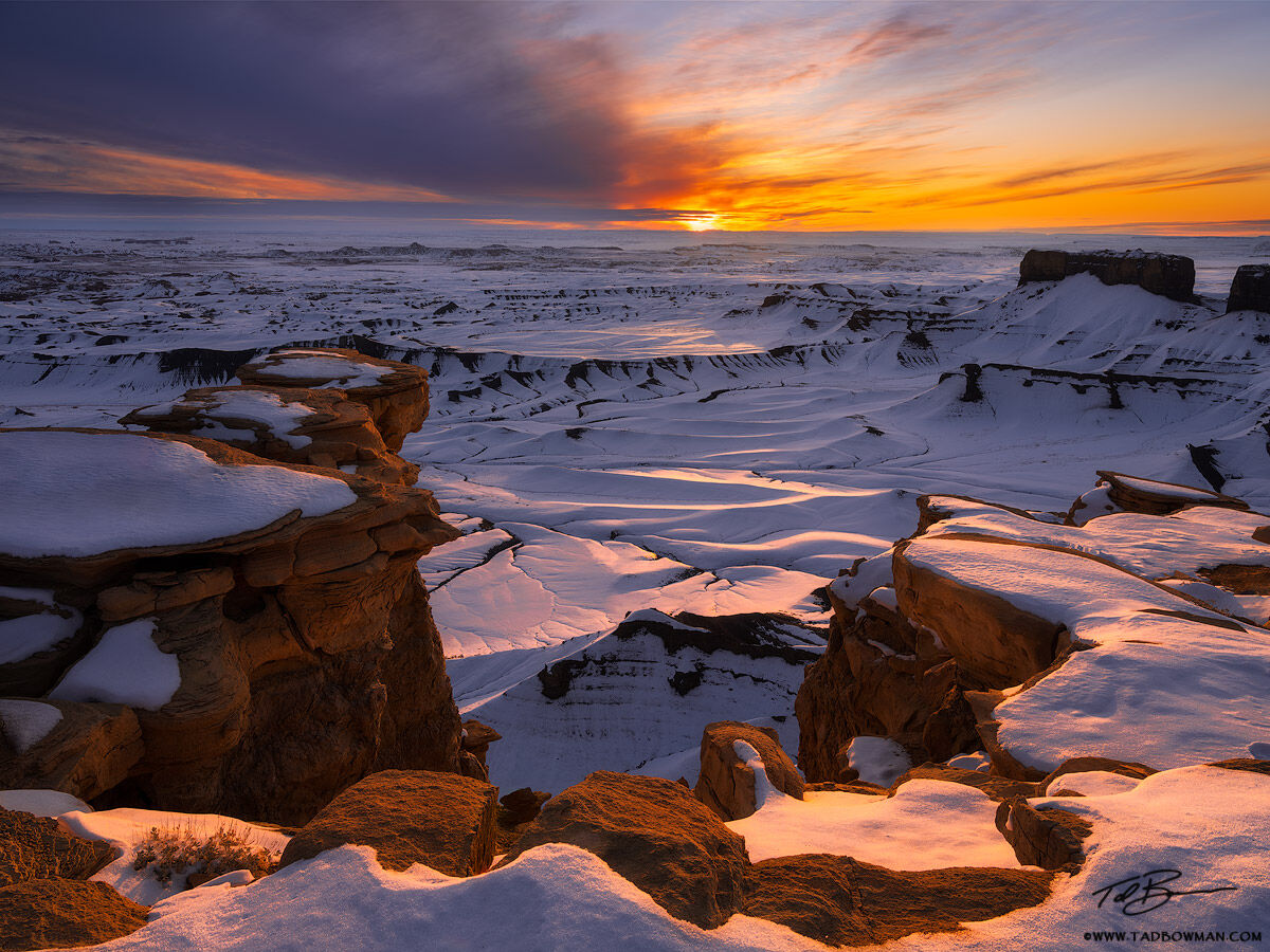 This Utah desert photo depicts a colorful sunrise at an overlook near Hanksville, Utah