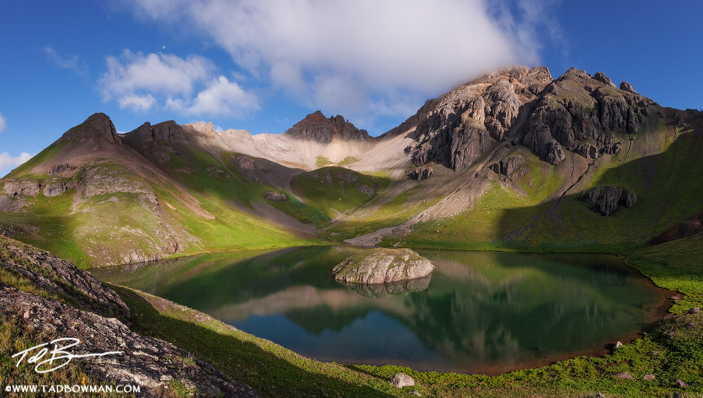 This Colorado panoramic photograph depicts early morning light on Ulysses S Grant Peak and Island Lake in the San Juan Mountain...