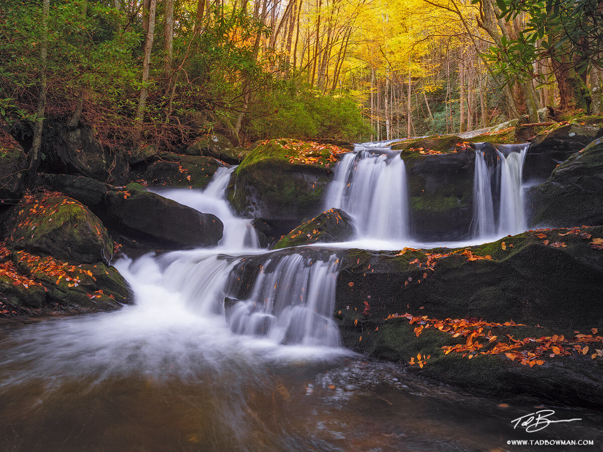This Smoky Mountains photo depicts a waterfall along Middle Prong River with colorful fall foliage in the background