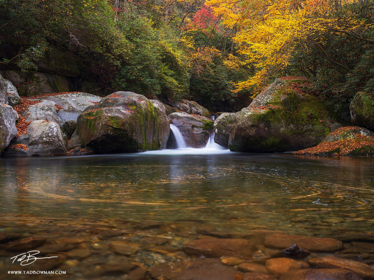 This Smoky Mountains photo depicts an area called 'Midnight Hole' with fall foliage surrounding it