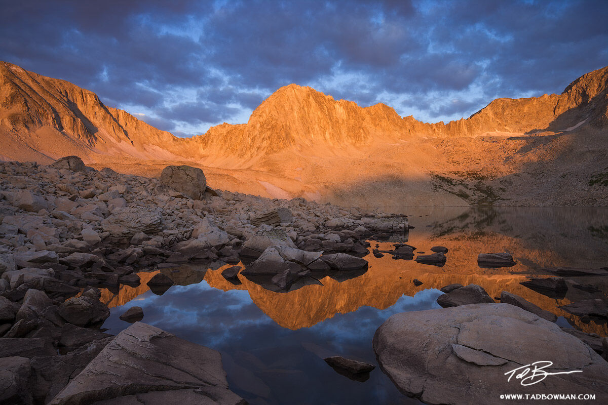 This Colorado mountain photo depicts sunrise on an unnamed peak reflecting in one of the Pierre Lakes in the White River National...