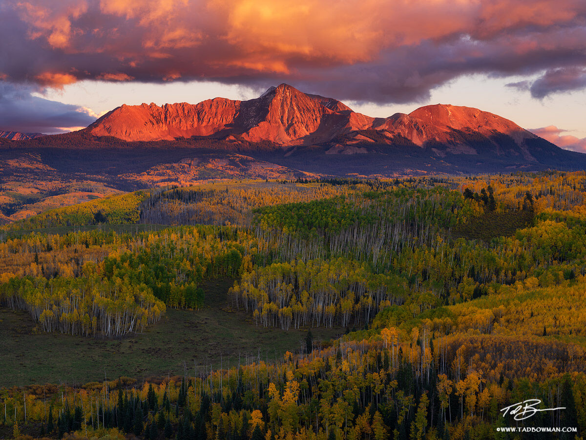 This Colorado mountain photo depicts the San Miguel Mountains with rich warm colors at sunset with colorful fall foliage in the...