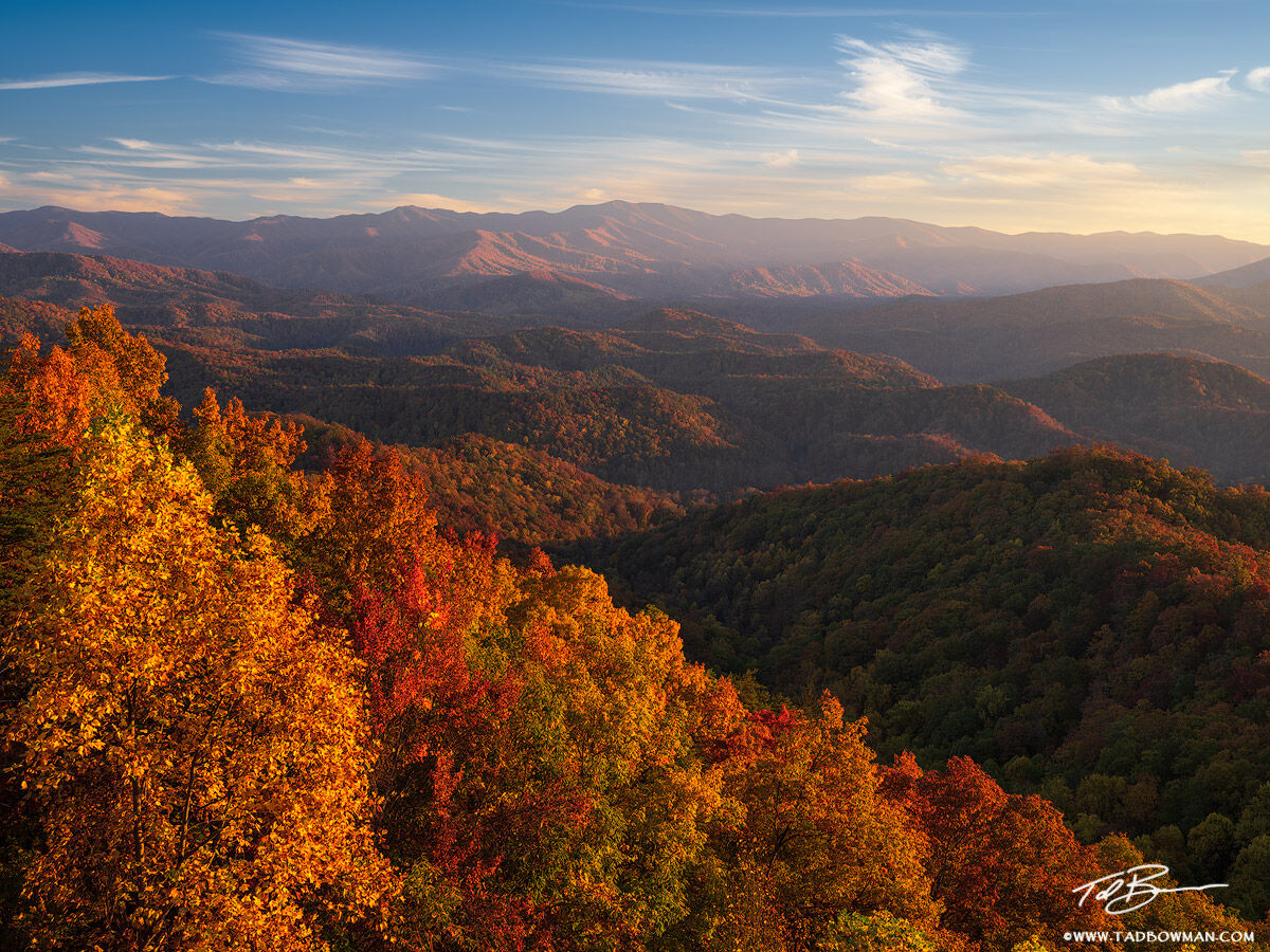 This Smoky Mountain photo depicts warm late afternoon light on the mountains with colorful fall foliage in the foreground