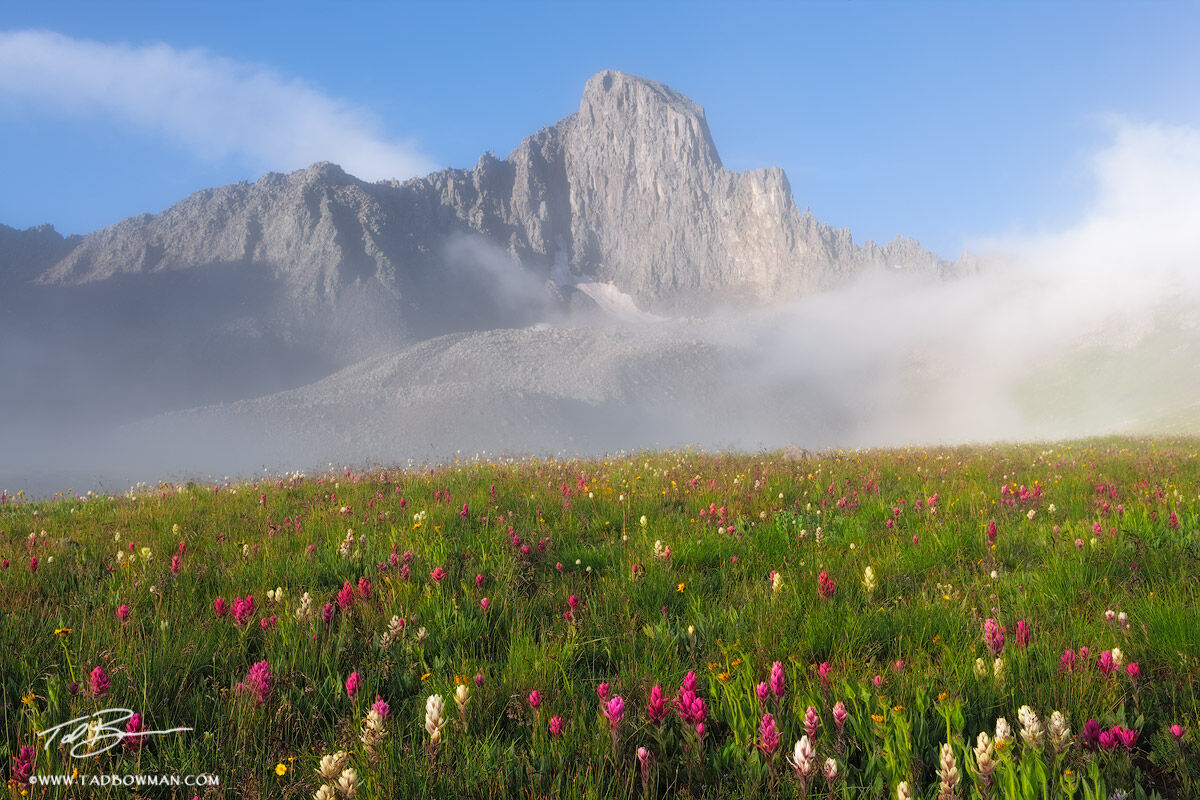 This Colorado mountain photograph depicts sunrise with foggy conditions over Wetterhorn Peak in the Uncompahgre Wilderness.